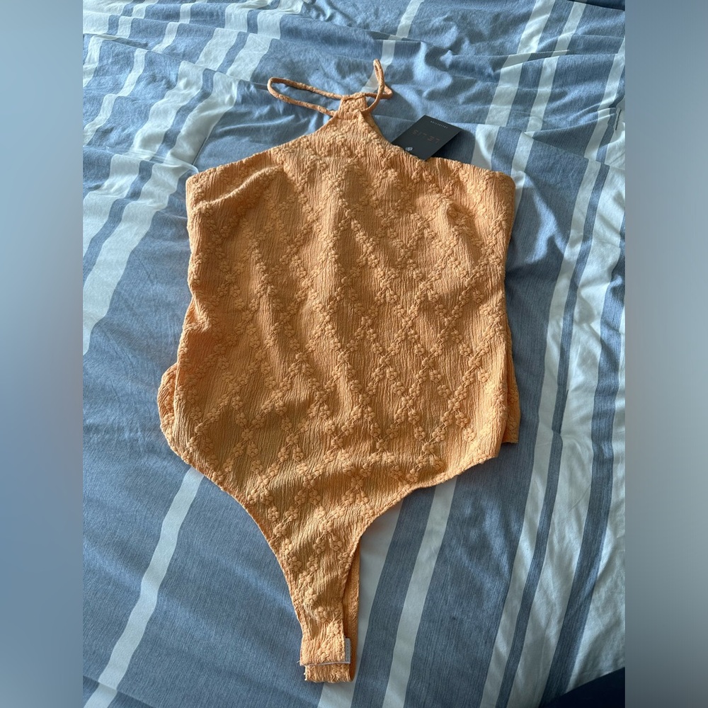Le Lis body suit. Bnwt